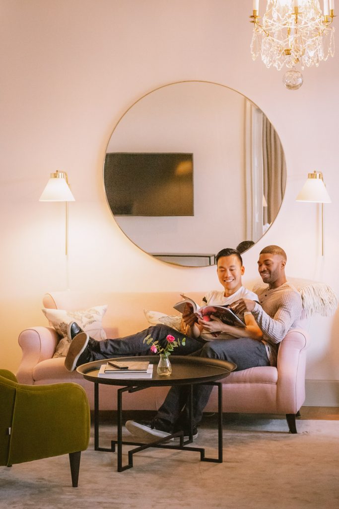 Interracial gay couple hotel lobby Stockholm queer photographer